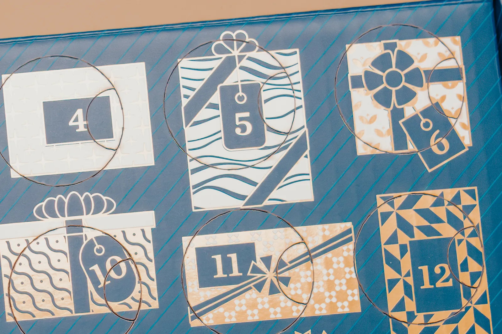 Gold foil gift-box artwork on the 2026 Advent Calendar packaging