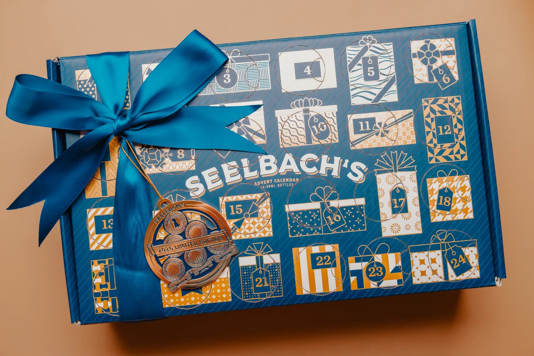 Seelbach's 2026 American Craft Whiskey Advent Calendar with its signature blue bow and collectible ornament